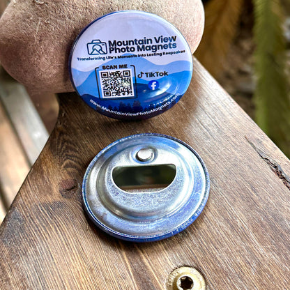 Round bottle cap opener with blue rim on a wooden surface, featuring Mountain View Photo Magnets branding.